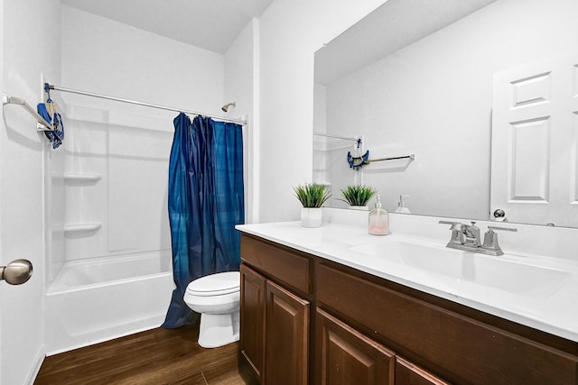 bathroom featuring shower / bath combo, vanity, toilet, and wood finished floors