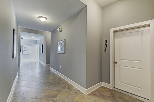 1011 Studemont St Unit 304, Houston, TX 77007 - hall featuring baseboards and light tile patterned flooring