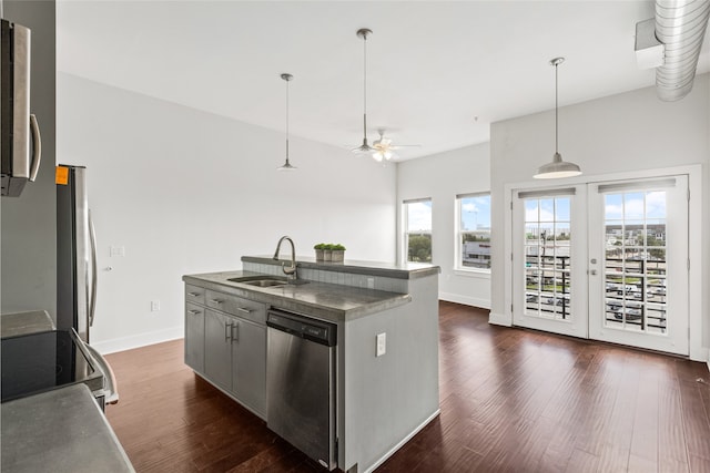 1011 Studemont St Unit 304, Houston, TX 77007 - kitchen with a sink, appliances with stainless steel finishes, healthy amount of natural light, and dark wood-style flooring