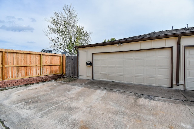 garage with fence