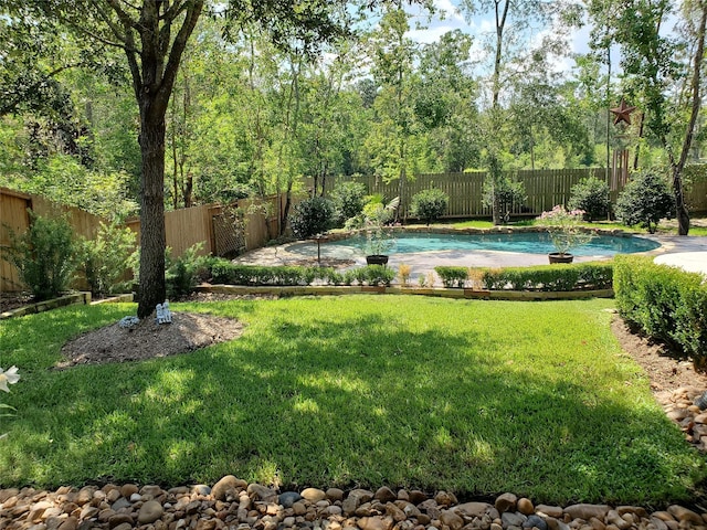 view of yard featuring a fenced in pool and a fenced backyard