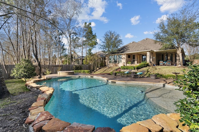 view of pool with a patio, a fenced backyard, and a fenced in pool