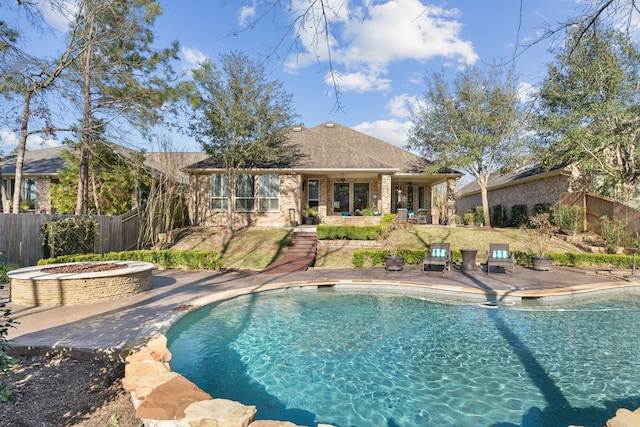 view of pool featuring fence, a fenced in pool, and a patio