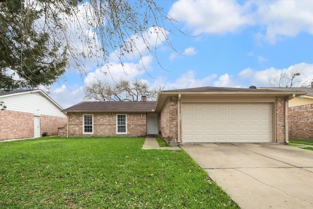 single story home featuring a garage, a front yard, brick siding, and driveway