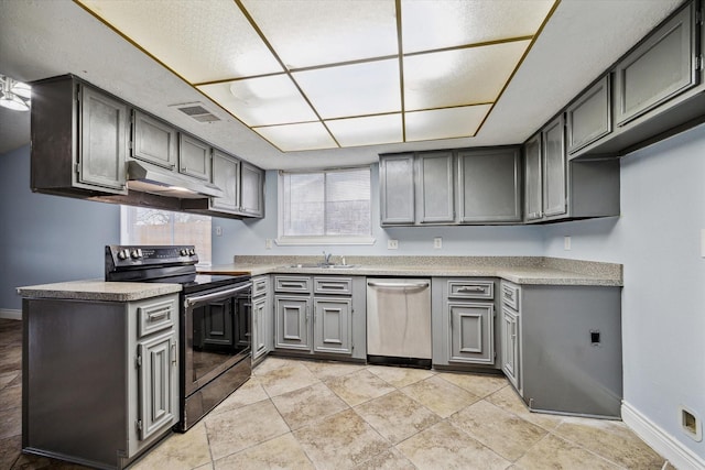 kitchen with black electric range, light countertops, visible vents, stainless steel dishwasher, and under cabinet range hood