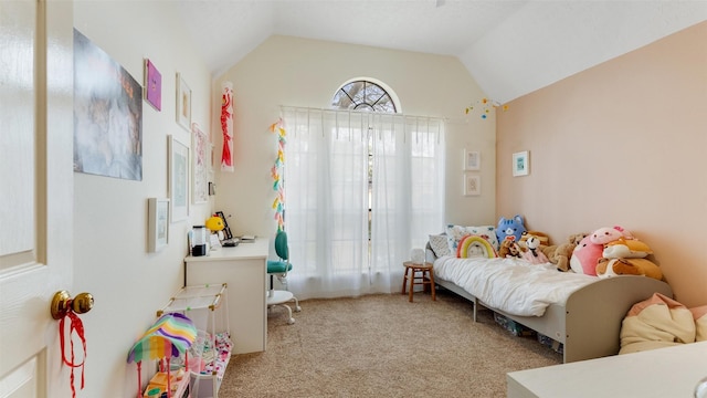 bedroom featuring carpet and vaulted ceiling