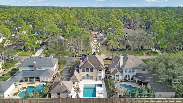 bird's eye view featuring a residential view and a view of trees