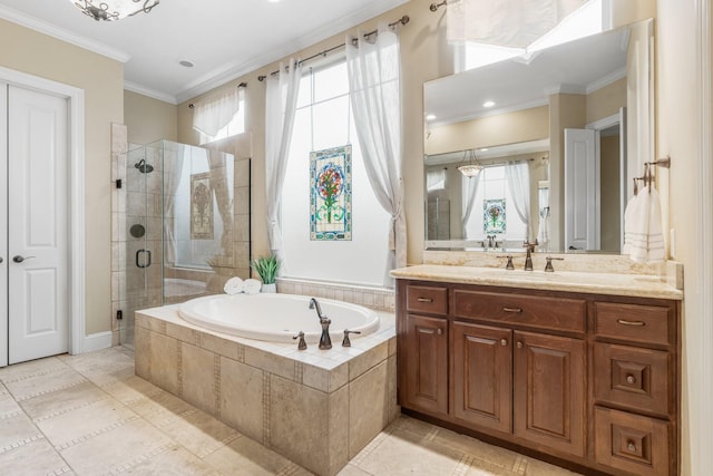 full bathroom with ornamental molding, a garden tub, a shower stall, and vanity