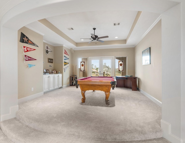 playroom with visible vents, baseboards, french doors, a tray ceiling, and carpet