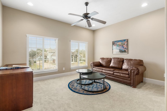 carpeted living area featuring a ceiling fan, recessed lighting, and baseboards