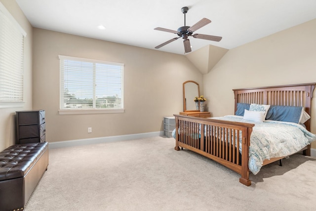 carpeted bedroom with multiple windows, a ceiling fan, and baseboards