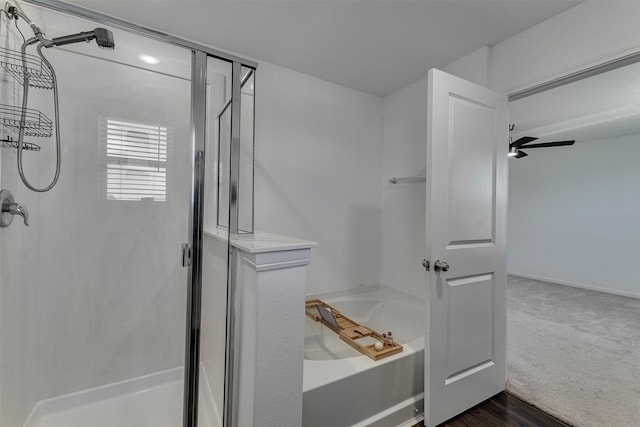 full bathroom featuring a shower stall and a bath