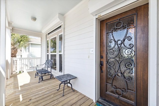 property entrance with covered porch