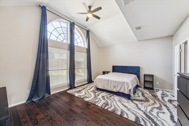 bedroom featuring lofted ceiling, ceiling fan, wood finished floors, visible vents, and baseboards