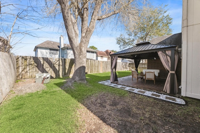 view of yard with a fenced backyard and a gazebo