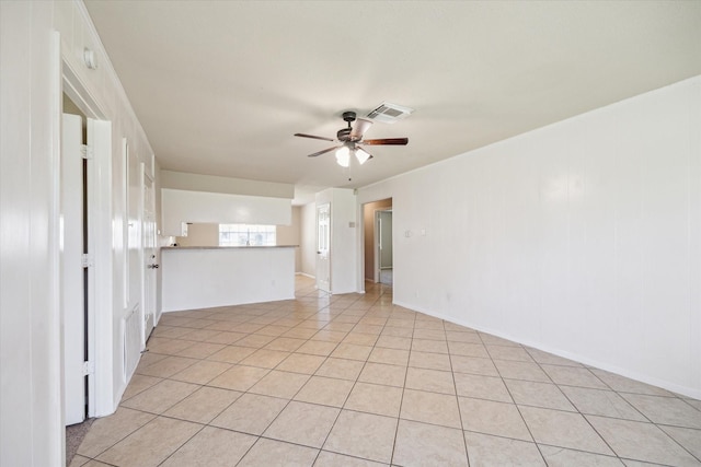 unfurnished living room with light tile patterned floors, visible vents, and ceiling fan