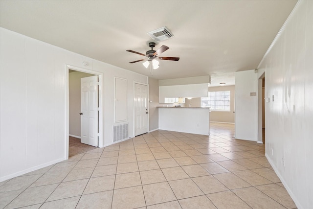 unfurnished living room with light tile patterned flooring, visible vents, and ceiling fan