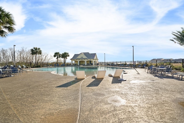 view of pool featuring a patio area and fence