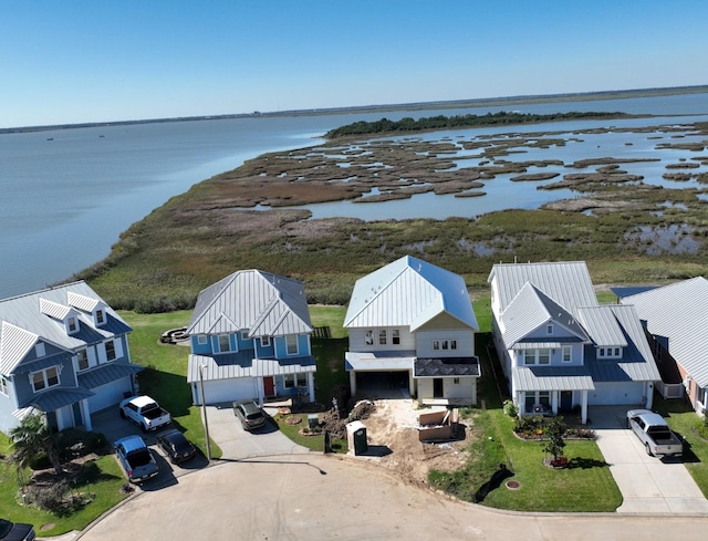 bird's eye view with a water view and a residential view