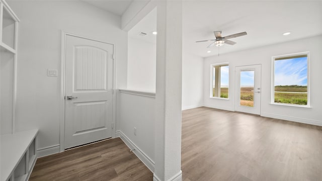 interior space with dark wood finished floors, recessed lighting, visible vents, ceiling fan, and baseboards