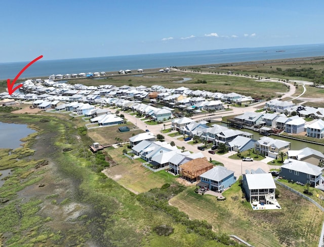 bird's eye view with a water view and a residential view