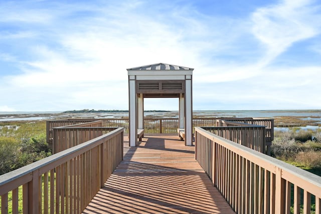 surrounding community featuring a water view