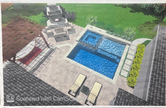 view of pool featuring a pool with connected hot tub, a patio, and exterior fireplace