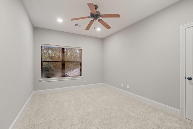 carpeted empty room featuring recessed lighting, visible vents, ceiling fan, and baseboards