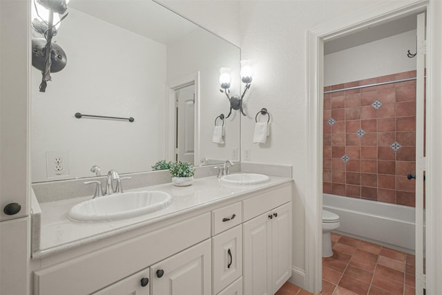 full bath featuring double vanity, shower / bathing tub combination, a sink, and toilet