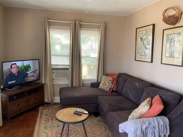 living area with dark wood-style floors and cooling unit