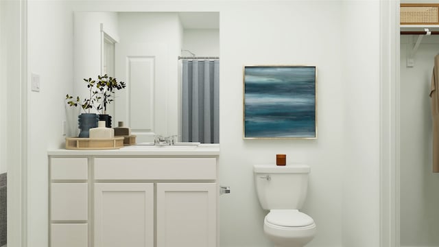 bathroom featuring toilet, a shower with shower curtain, and vanity