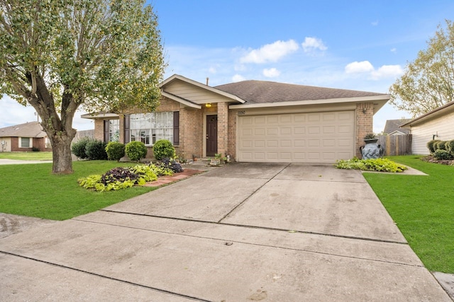 view of front of house with a garage, driveway, brick siding, and a front lawn