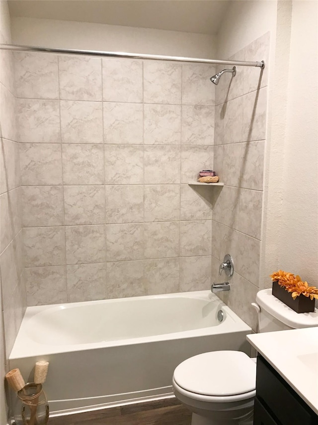 full bathroom with shower / washtub combination, vanity, toilet, and wood finished floors