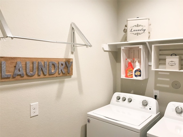 laundry room with laundry area and washer and clothes dryer