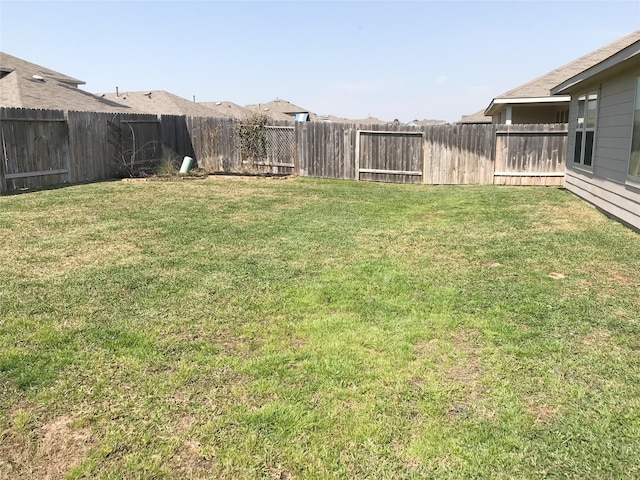 view of yard featuring a fenced backyard