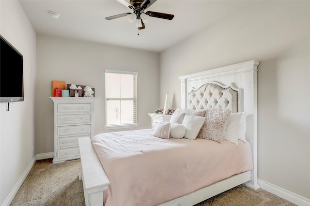 bedroom featuring baseboards, ceiling fan, and light colored carpet