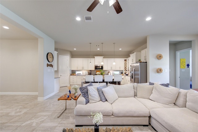 living area with baseboards, ceiling fan, visible vents, and recessed lighting