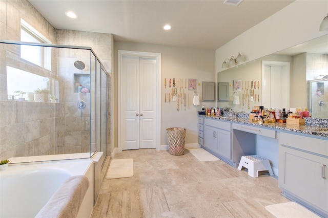 bathroom featuring a garden tub, recessed lighting, vanity, baseboards, and a stall shower