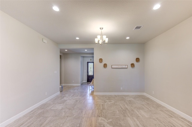 empty room featuring recessed lighting, visible vents, and baseboards