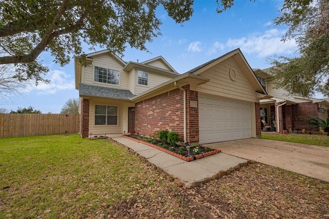 traditional-style house featuring brick siding, a front yard, fence, a garage, and driveway