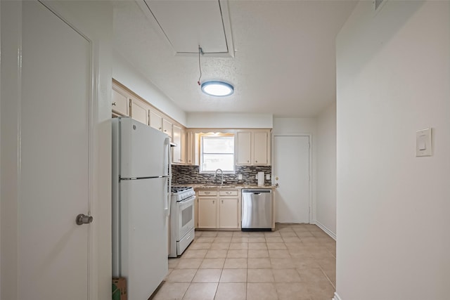 kitchen with light tile patterned floors, decorative backsplash, a sink, a textured ceiling, and white appliances