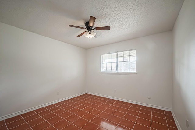 unfurnished room with a textured ceiling, a ceiling fan, and baseboards