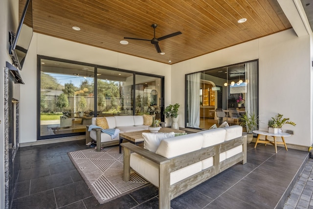 view of patio featuring an outdoor living space and a ceiling fan