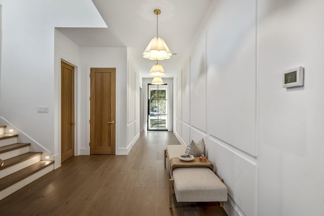 hall with stairway and wood finished floors