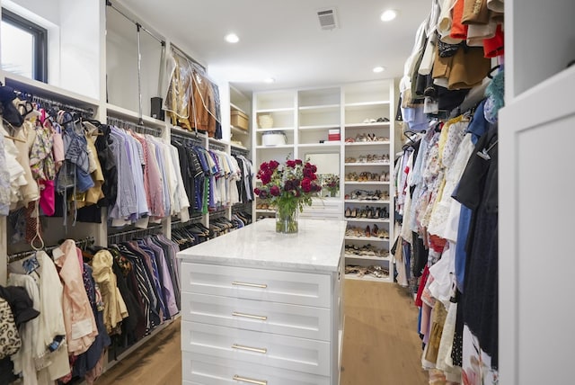 spacious closet with visible vents and light wood-style flooring