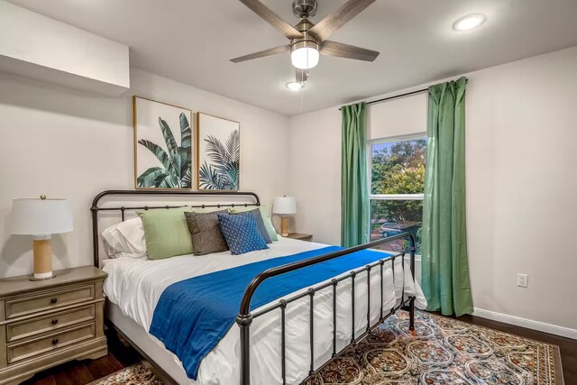 bedroom with dark wood-style floors, recessed lighting, ceiling fan, and baseboards