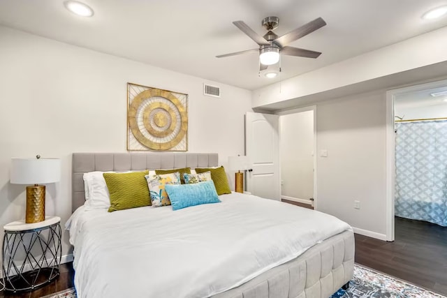 bedroom featuring dark wood-style floors, recessed lighting, visible vents, and baseboards