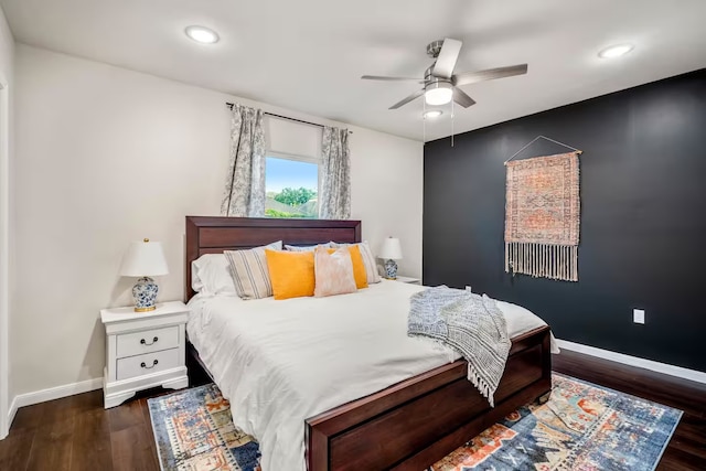 bedroom featuring dark wood-style floors, recessed lighting, and baseboards