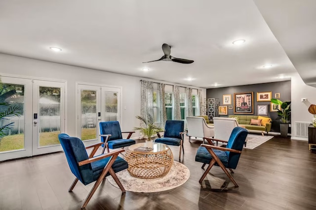 sitting room with ceiling fan, french doors, dark wood finished floors, and visible vents