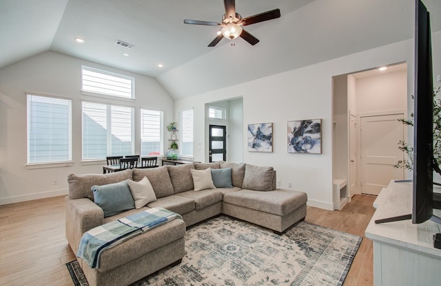 living room with light wood finished floors, baseboards, visible vents, vaulted ceiling, and recessed lighting